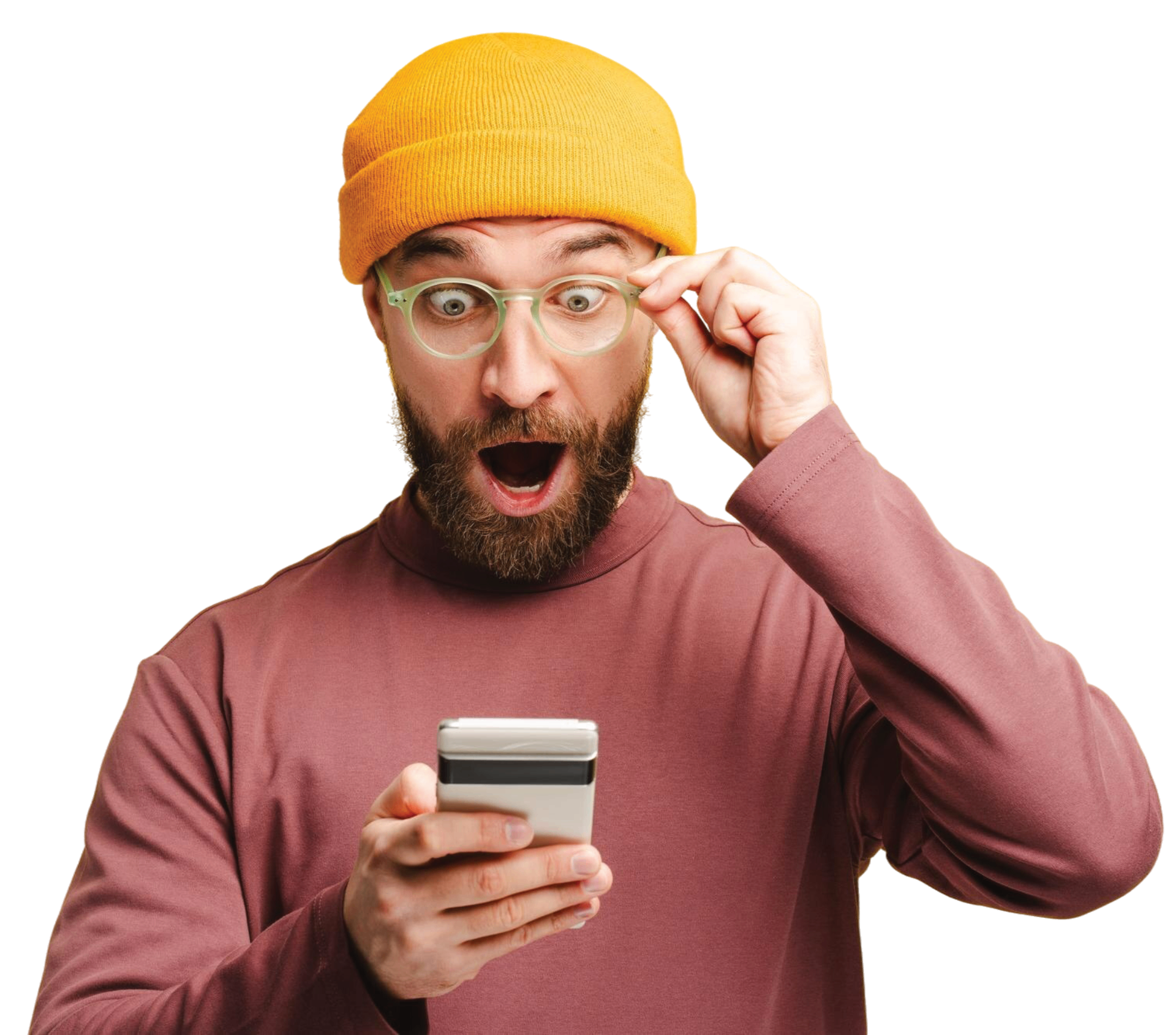 A man in a yellow beanie hat and glasses looking surprised at his phone