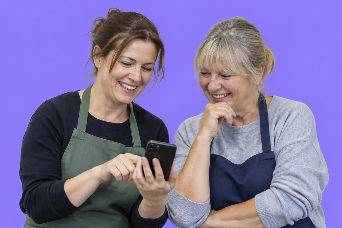 Charity workers pleased their phones are working.