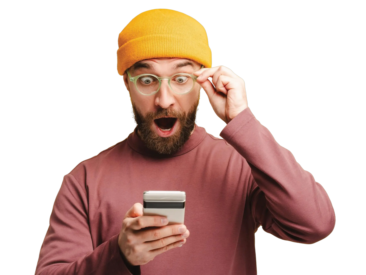 A man in a yellow beanie hat and green glasses looking at his phone in surprise